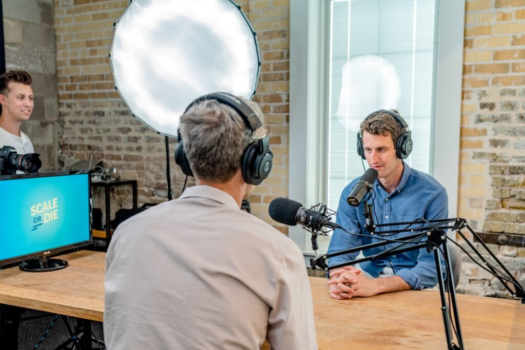 Recording a new podcast interview with CEOs and Founders of successful online businesses, Scale or Die. This show recently hit Apple's New and Noteworthy for business and technology categories. Watch or listen to the most recent episodes at useproof.com/scaleordie.