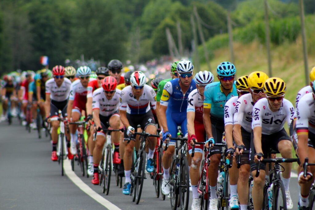 group of men riding bicycle