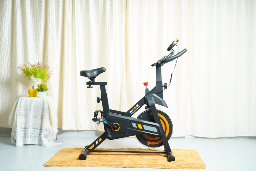 WROGX Spin 100 🚴‍♂️ Max User Weight Support: 90KG 🔄 Flywheel: 4 KG 📊 LCD Monitor Display: Track Speed, Time, Calories 📱 Mobile/Tablet Device Holder 💪 Adjustable Resistance Knob 🪑 Adjustable Ergonomic Seat 🖤 Compact, Sleek, Premium Design in Black Color 🚚 Adjustable Wheels - Move Anywhere at Home Visit https://wrogx.com/products/spin100 to know more